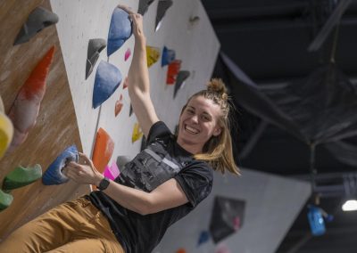 Woman Rock Climbing At Bloc Garten