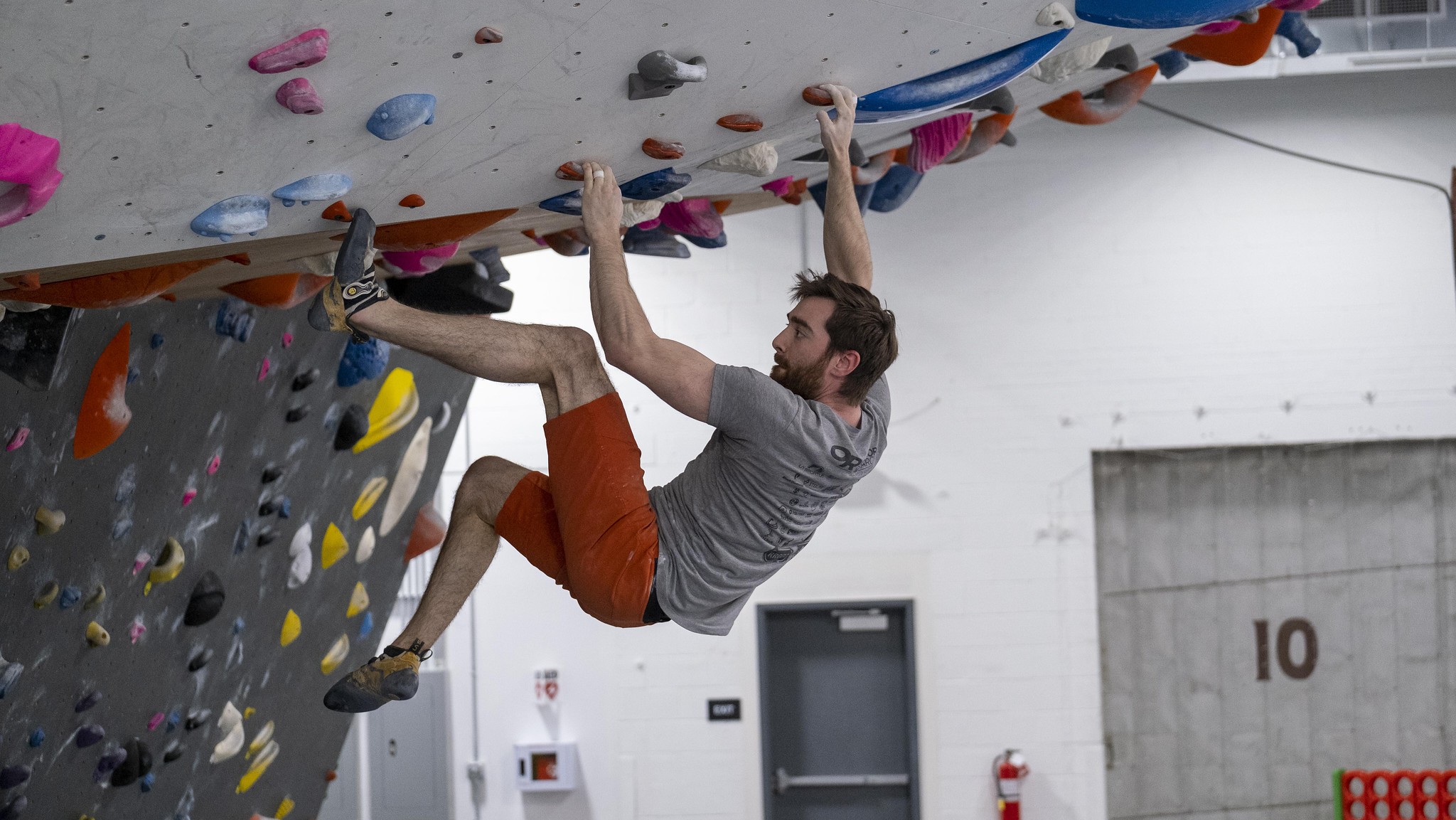 climber attempting a V3