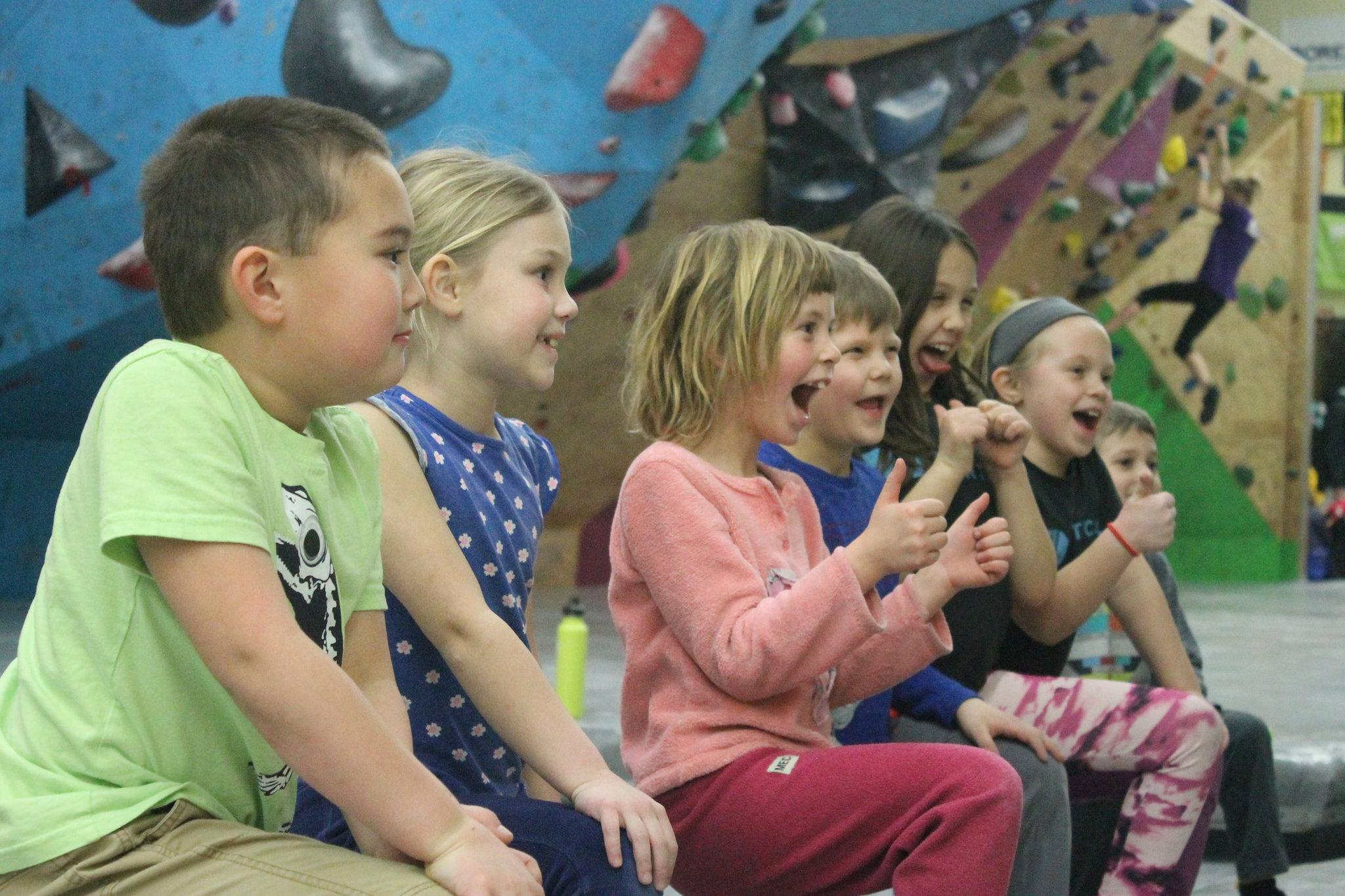 A group of young kids cheering together at Bloc Garten