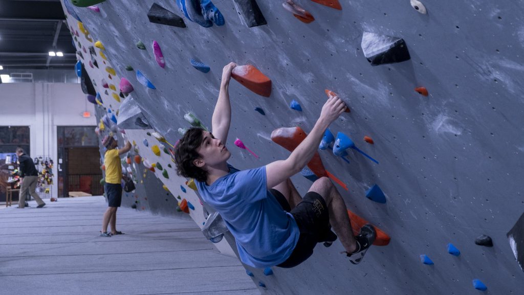 male climber bouldering