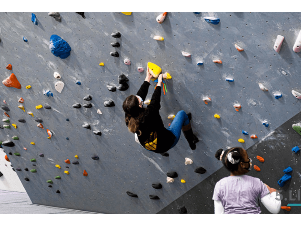 kids climbing in a rock climbing gym