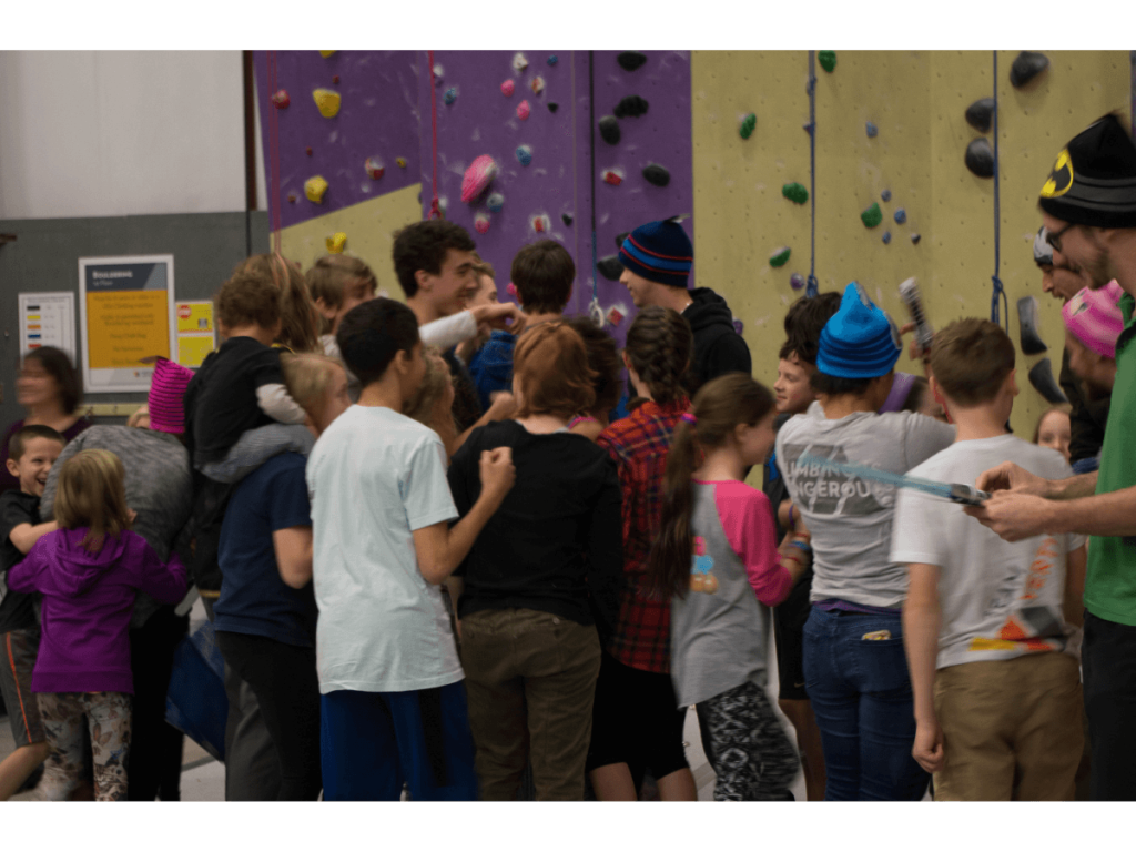people in a climbing gym