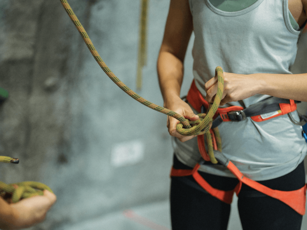 female climber wearing her climbing harness